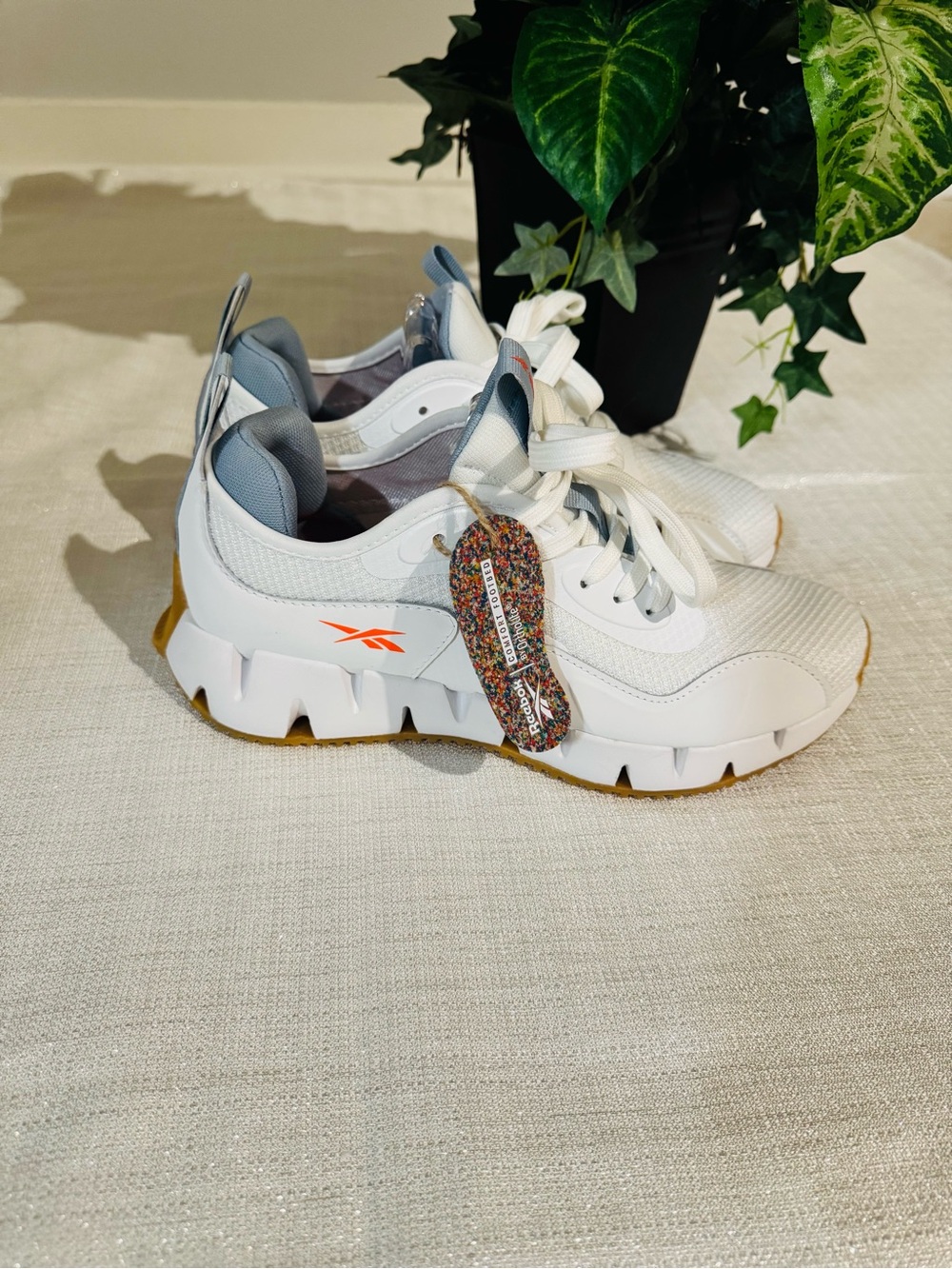 Reebok White Sneakers with Orange Accent and Gum Sole